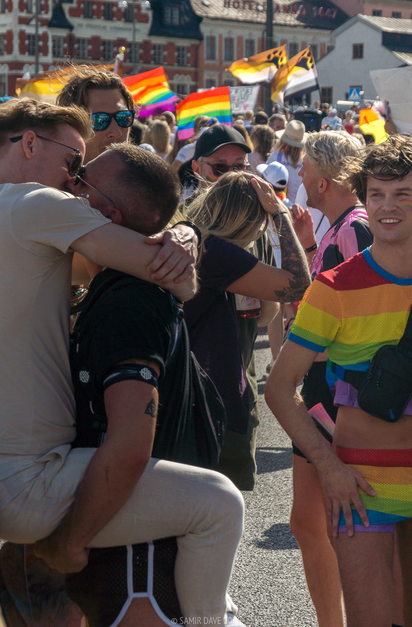 Lost in a moment of love, two people kiss at Stockholm Pride Festival 2026.