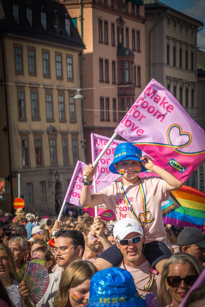 A child riding on an adults shoulders and IKEA reminding us to make room for love, Stockholm Pride Festival 2026.